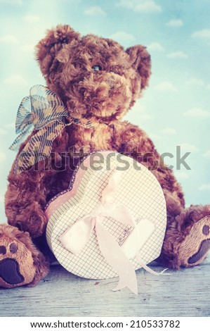 Toy bear with gift heart box