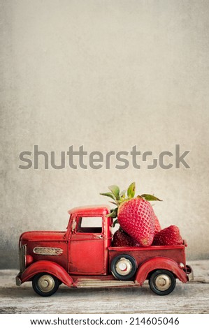 Vintage toy truck with strawberries
