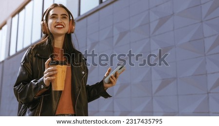 Similar – Image, Stock Photo Happy young woman listening music in headphones in the city