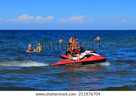 KULIKOVO, RUSSIA - JULY 19, 2014: Active recreation - driving on a hydrocycle on the Baltic Sea in Kulikovo, the Kaliningrad region