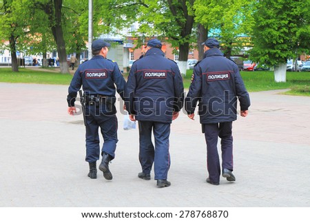 KALININGRAD, RUSSIA - MAY 8, 2014: Three policemen, seen from behind, in Kaliningrad