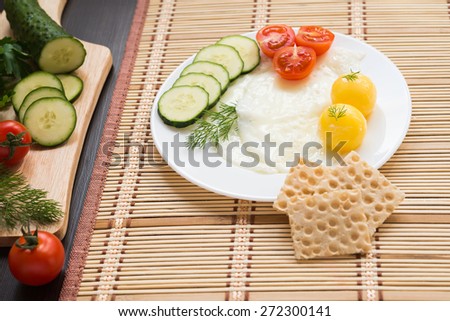 Breakfast - fried eggs (with raw frozen yolk) and vegetables
