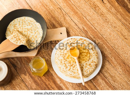Pancakes with honey. Traditional Russian food - pancake week