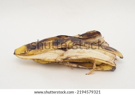 a pile of rotten banana skins on white background ストックフォト © 