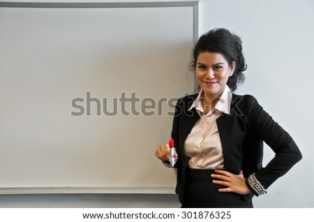 Business woman present with draw board on white background and laughing.