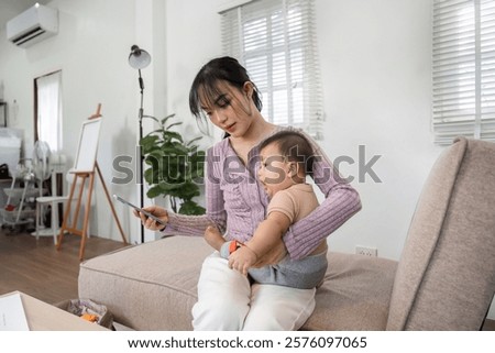 Similar – Image, Stock Photo Mother checking on her children who is riding in the front section of a cargo bike