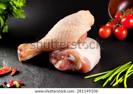 Fresh and raw meat. Raw chicken thighs white  ready to cook. Background black blackboard