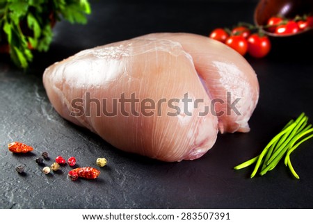 Raw and fresh meat. whole uncooked chicken breast without cutting