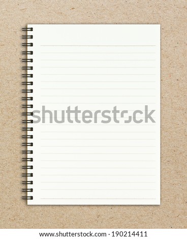 Blank realistic spiral notepad notebook on brown paper sheet background