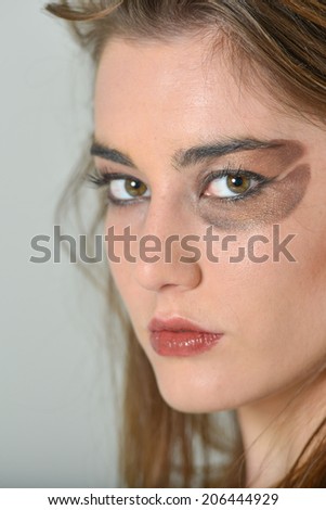 Beautiful young woman with coffee bean make up