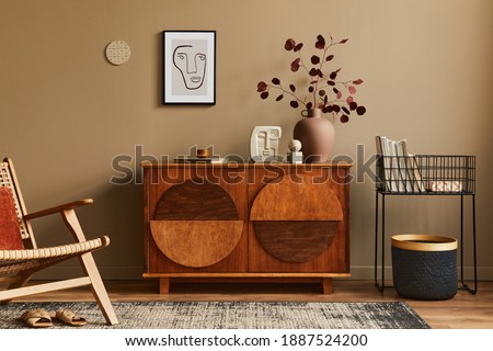Interior design of unique living room with stylish commode, armchair, dired flowers in vase, mock up poster on the wall, carpet, decoration and personal accessories in modern home decor. Template. Photo stock © 