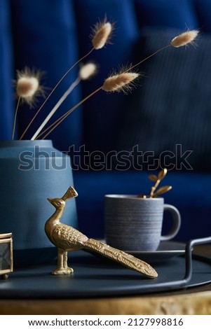 Similar – Image, Stock Photo Accessory composition detail for women and girls. White flower in a small ceramic vase with copper bracelet and golden rings and leather bag on a wooden side table at a white wall in a bright room.