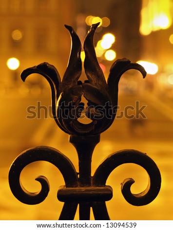 Wrought iron fence detail at night