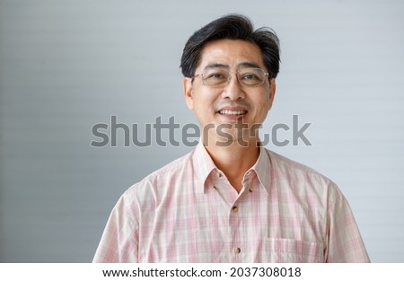 Similar – Image, Stock Photo Asian man in eyeglasses on street