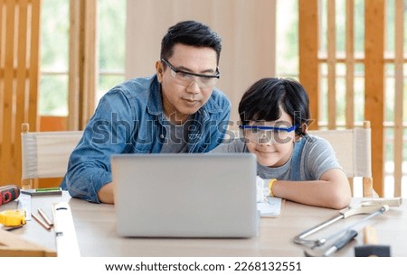 Similar – Image, Stock Photo Male woodworker teaching son in workshop