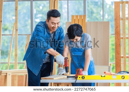 Image, Stock Photo Male woodworker teaching son in workshop