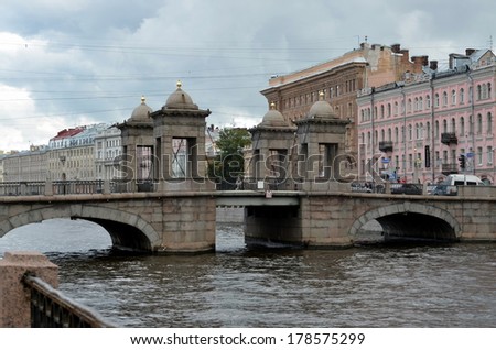 ST-PETERSBURG, RUSSIA, AUGUST 24, 2013:  Lomonosov Bridge across the Fontanka River is the best preserved of towered movable bridges that used to be typical for Saint Petersburg in the 18th century
