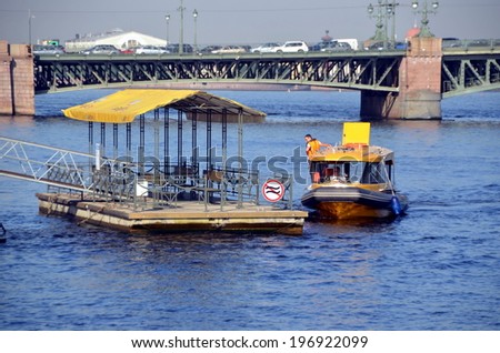 SAINT-PETERSBURG, RUSSIA, JUNE 5, 2014 -Â?Â? Aquabus approaches to  the water station.  Kutuzov Embankment, St. Petersburg, Russia