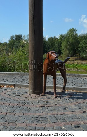 VOLOGDA, RUSSIA, AUGUST 16, 2014: Monument to the first electric lamp post in the city of Vologda. Townspeople call it monument to pissing dog