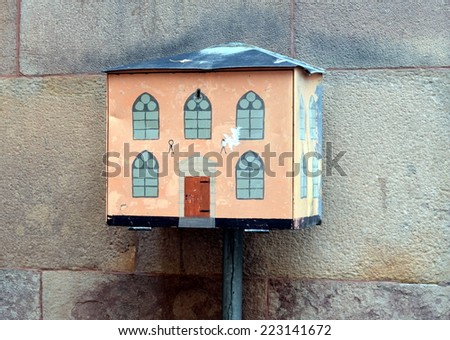 STOCKHOLM, SWEDEN, OCTOBER 9, 2013 - Mailbox, painted like an old house in Stockholm, Sweden