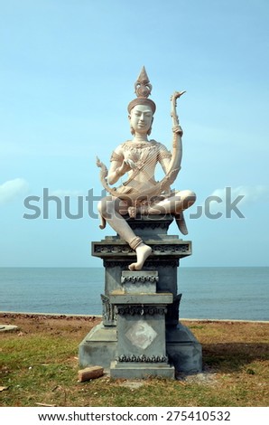 Embankment in Kep, Cambodia. Beautiful buddhist statue on the bank of the sea