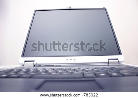 notebook screen with blurred out keyboard