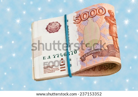 Russian 5000 rubles bank note on the background of snowflakes