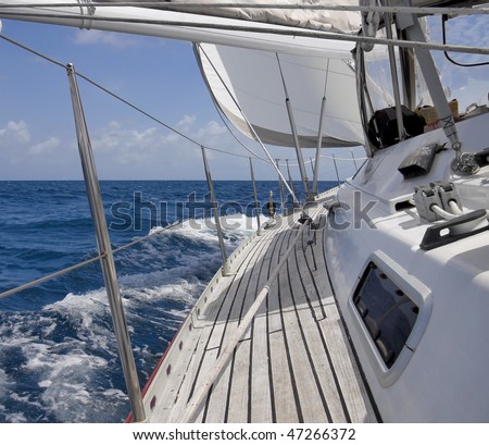 View from luxurious sailboat sailing through the ocean.