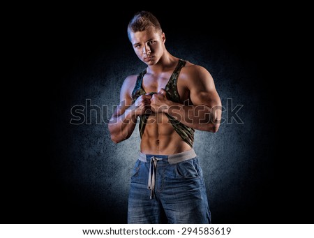 bodybuilder posing. Handsome power athletic guy male. Fitness muscular body