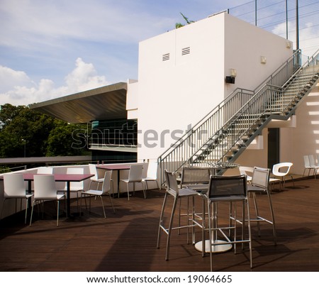 Bar opened on top of building roof with steel chairs