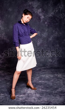 Chinese office lady in purple shirt and white skirt