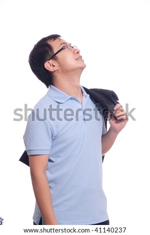 young chinese student in blue polo shirt holding black jacket in