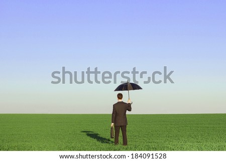 sustainable development insurance concept, businessman holding umbrella in the fields
