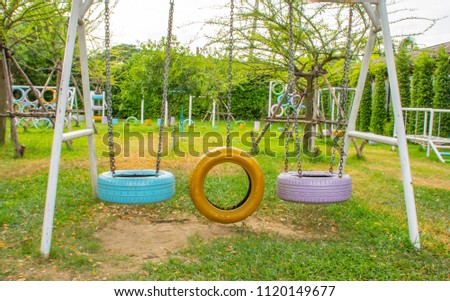 Similar – Image, Stock Photo black chain Tire Swing at a children’s  play ground no people