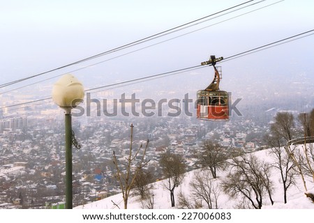 ALMATY, KAZAKHSTAN - MARCH 10, 2014: funicular with the view of the foggy city of Almaty, Kazakhstan