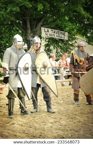 CHATEAUNEUF-DU-PAPE , FRANCE - AUGUST, 03, 2013: Historical Reconstruction of the knights Tournament during a free medieval festival held in the famous village of Chateauneuf-du-Pape, south of France.