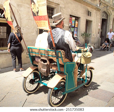 AVIGNON, FRANCE - JULY 19, 2014: Actors in historical costumes advertising their performance  during famous theatre festival from July 4 to 27, 2014 in Avignon, south of France.