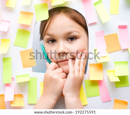 Cute girl with lots of reminder notes-school concept