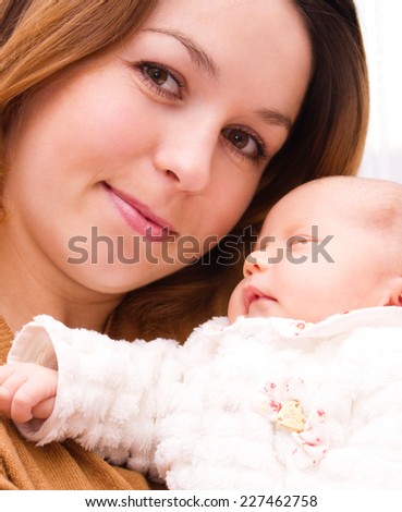 Mother holds cute baby