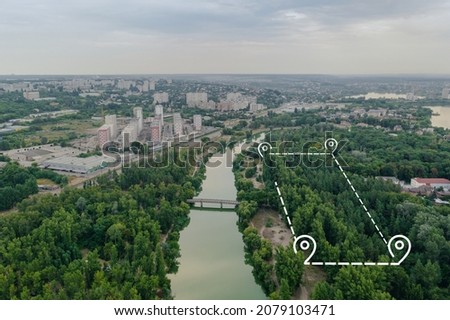 Topographic plot of land for rent. Lease of land with trees near the river in the city. Land for development. Land for sale and investment: Aerial drone shot.