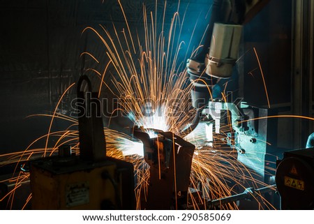 The movement of the robot welding in an auto parts factory.
