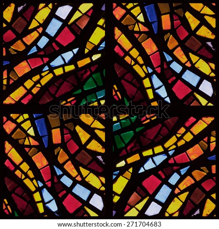 Stock photo - warm toned colorful stained glass church window in a kaleidoscope-like arrangement, square orientation