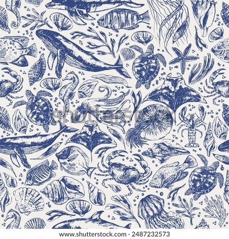 Vector sea animals seamless pattern. Sea life background in blue color with whale, dolphin, octopus, crab, seahorse, sea turtle, jellyfish, starfish, manta ray,  nautilus, shells.