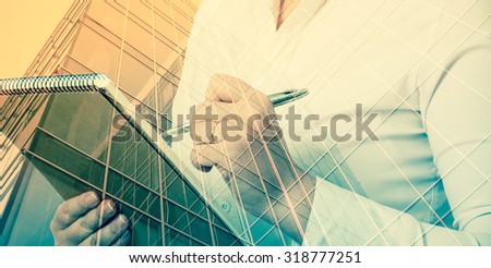 business, people and technology concept - double exposure businesswoman with notebook over city background.