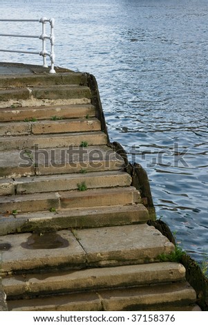 Flight of steps on the shore of Nervion river. Bilbao, Spain.