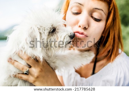 Woman with her dog during a day on Lake