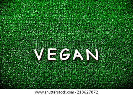 Veganism concept written with wood text letters. Vegan diet concept.