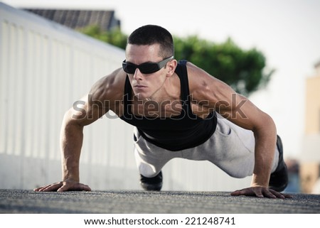 Fitness man exercising push ups.