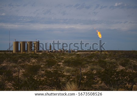 Similar – Image, Stock Photo Gas flaring at oil refinery in evening