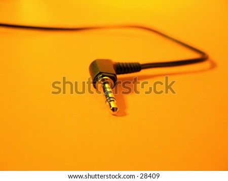 Focus on the tip of a headphone cord.